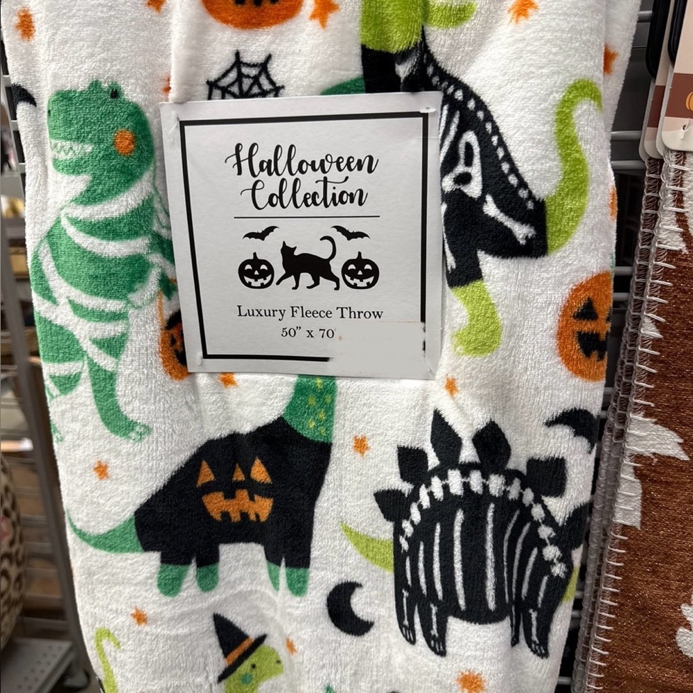 Halloween spooky dinosaur fleece throw